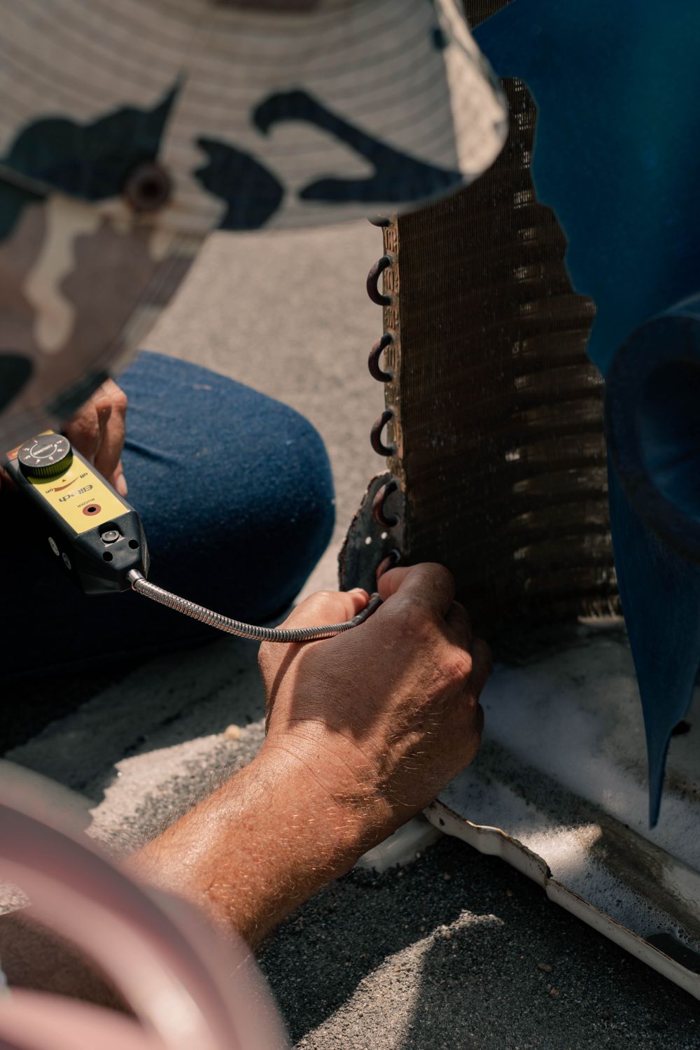 Technician performing HVAC maintenance on residential equipment